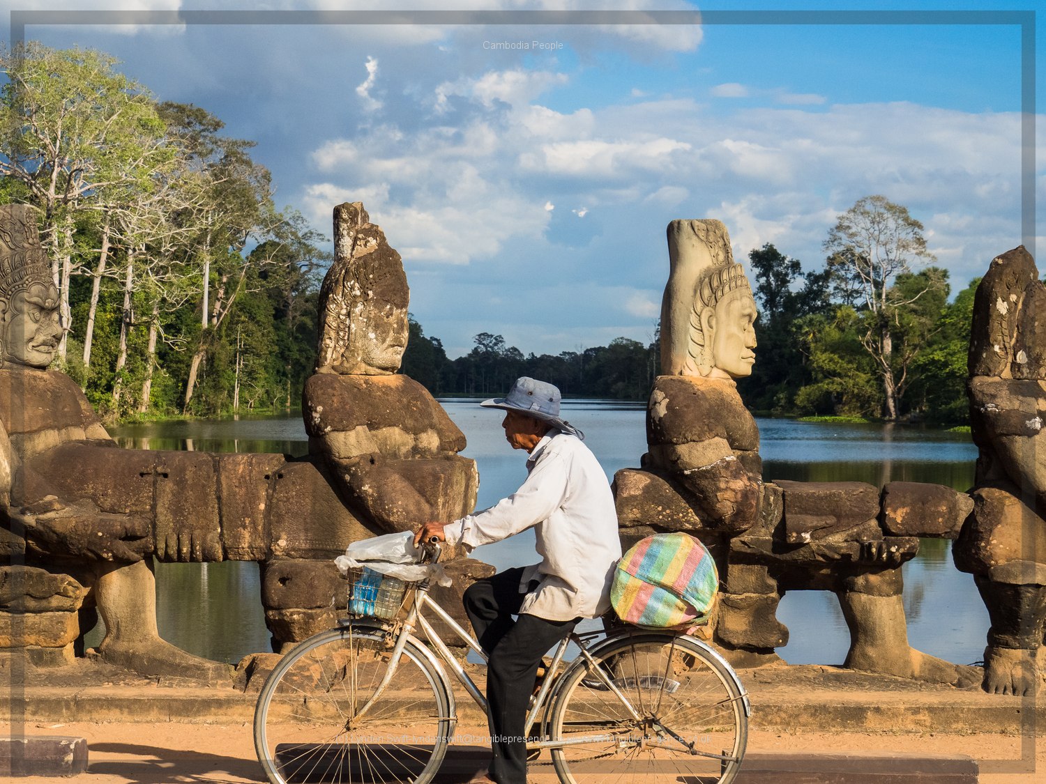  Man on bike. Cambodia. Lynden Swift. Tangible Presence Photography. 