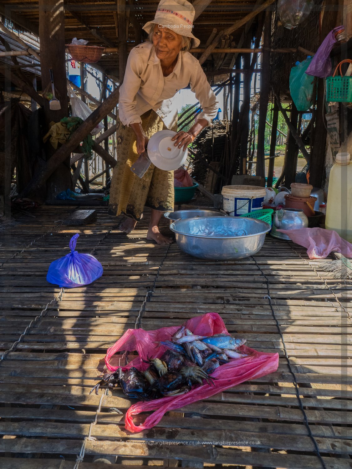  Woman in stilt village. Cambodia. Lynden Swift. Tangible Presence Photography. 