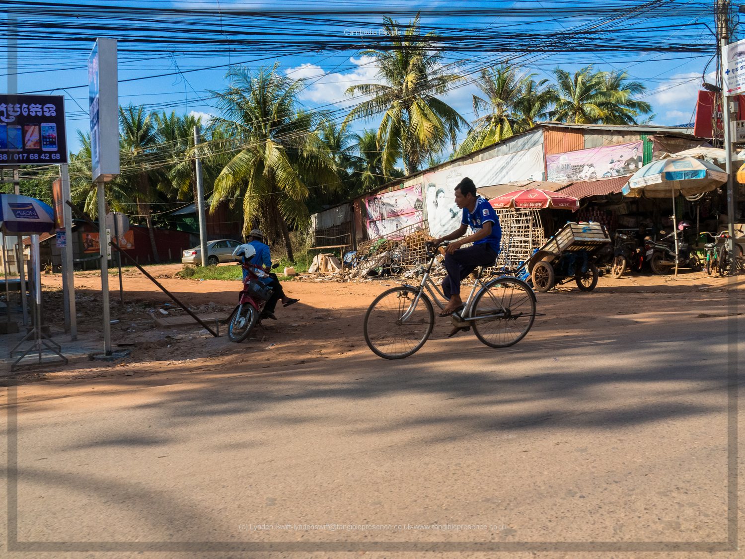  Cyclist. Cambodia. Lynden Swift. Tangible Presence Photography. 