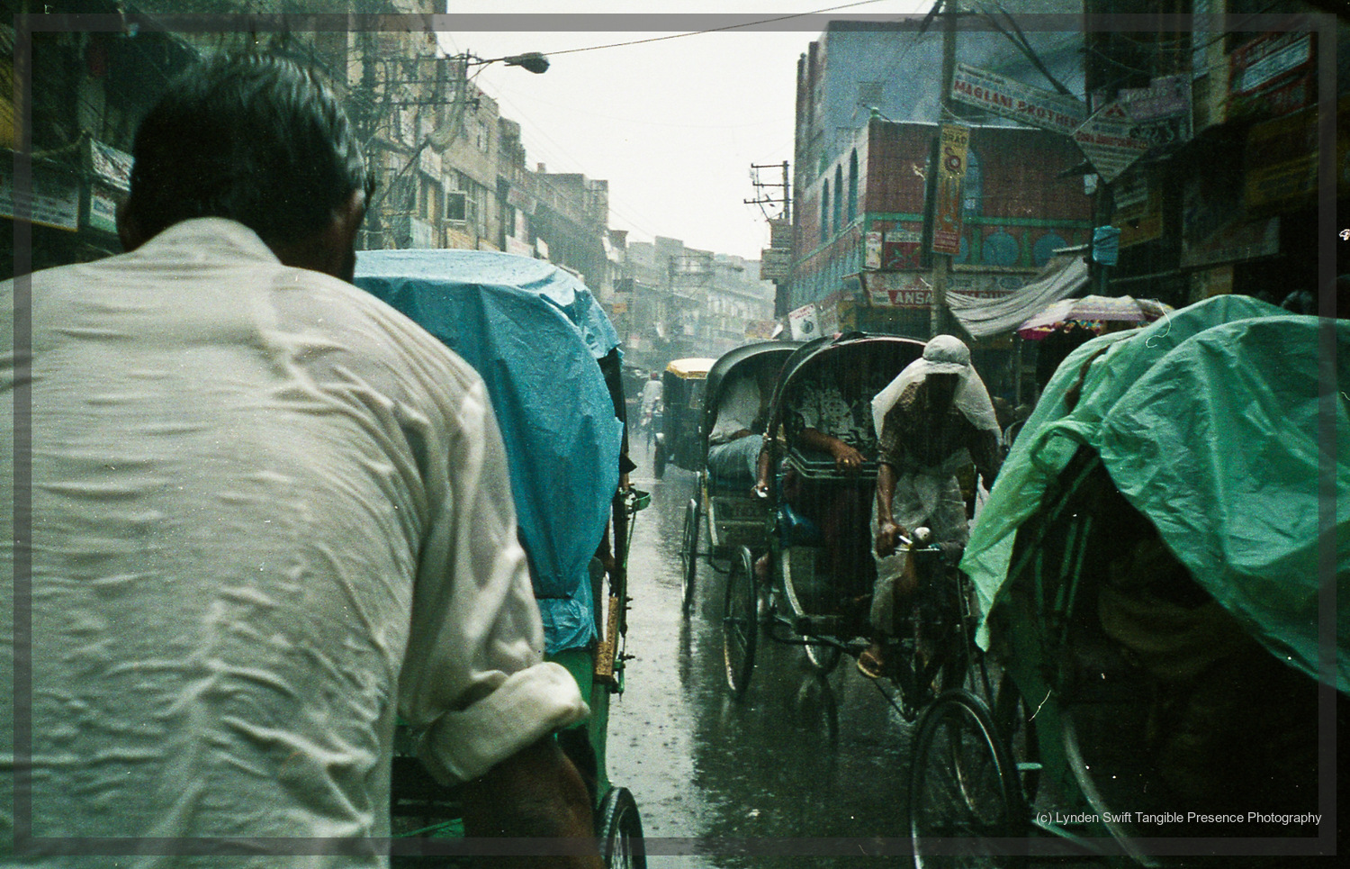  A mad ricksahw dash through the streets of Delhi in the monssoon. 