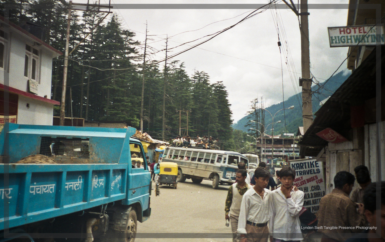  Note the crowd on top of the bus.  