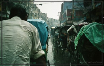  A mad ricksahw dash through the streets of Delhi in the monssoon. 